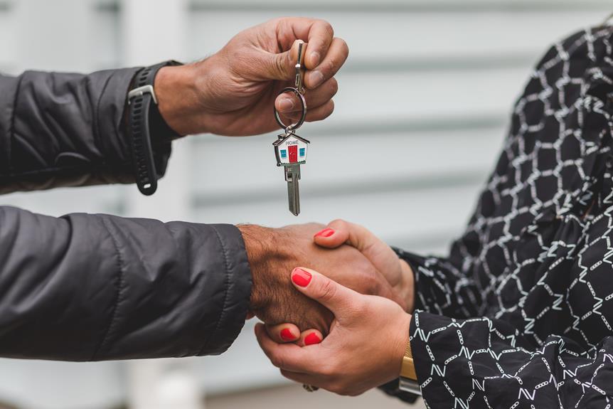 Realtor handing over keys to new home owner.